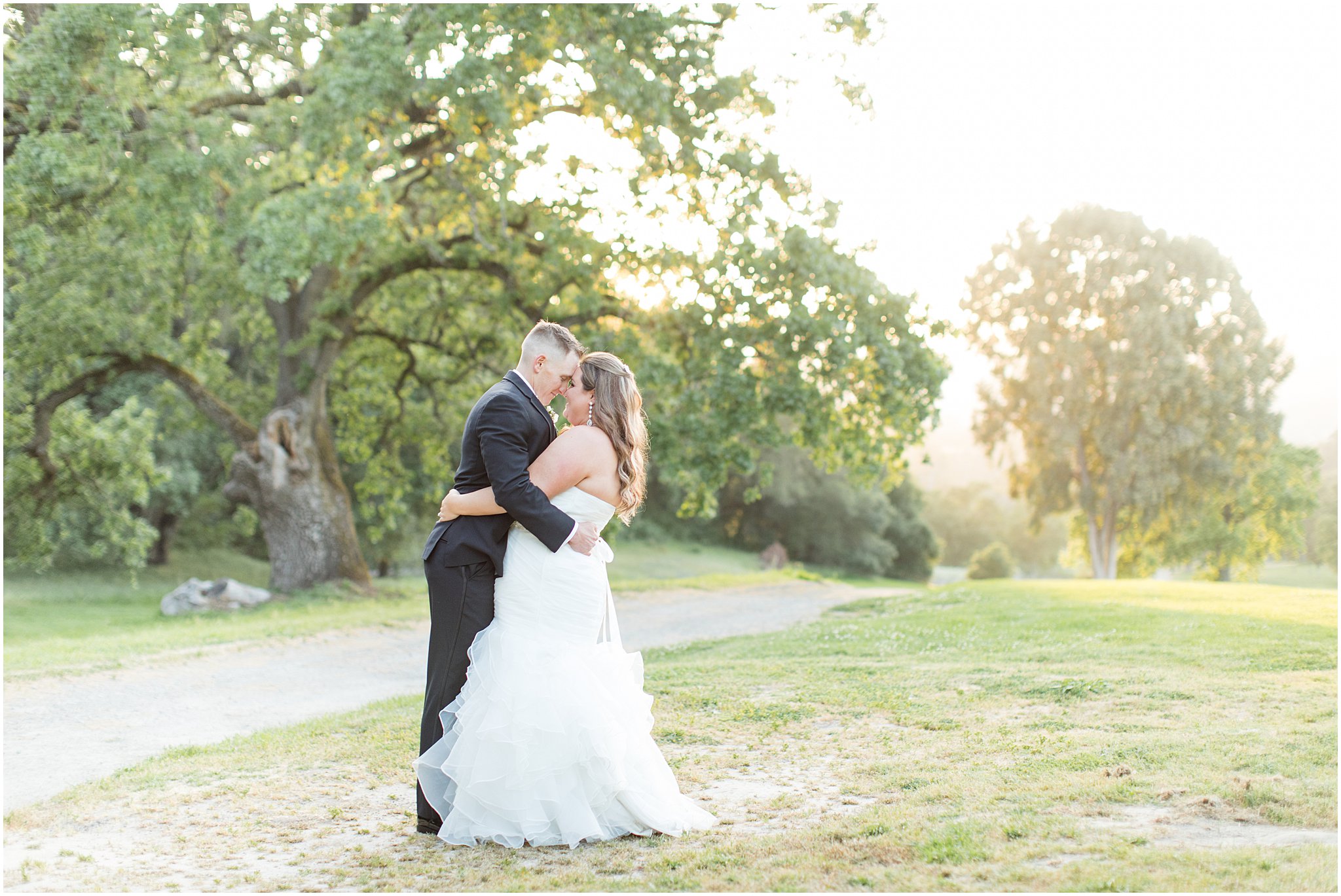 Bride and Groom embrace during golden hour on beautiful golf course