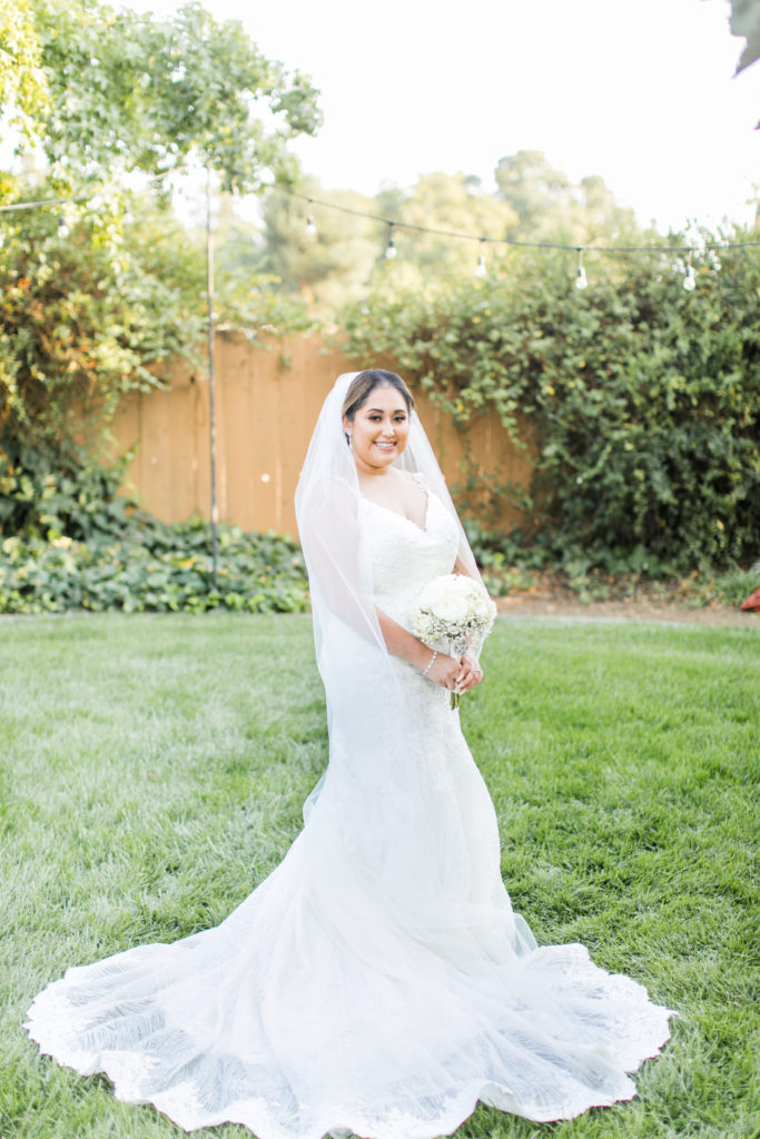 bride standing and smiling - wedding photo inspiration - backyard weddings - Angela Sue Photography