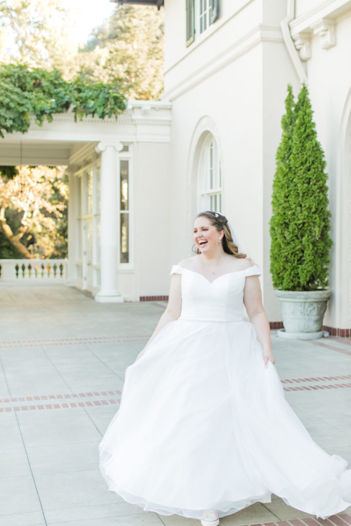 bride laughing and walking towards camera - wedding photo inspiration - Villa Montalvo - Angela Sue Photography
