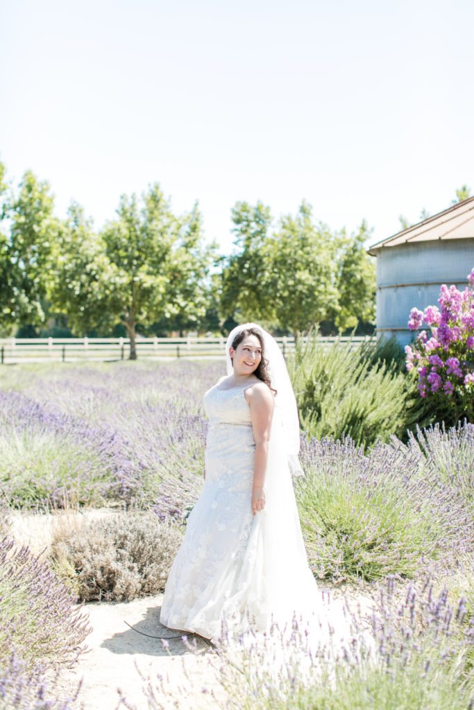 bride standing and smiling - wedding photo inspiration - Pageo Lavender Farm - Angela Sue Photography