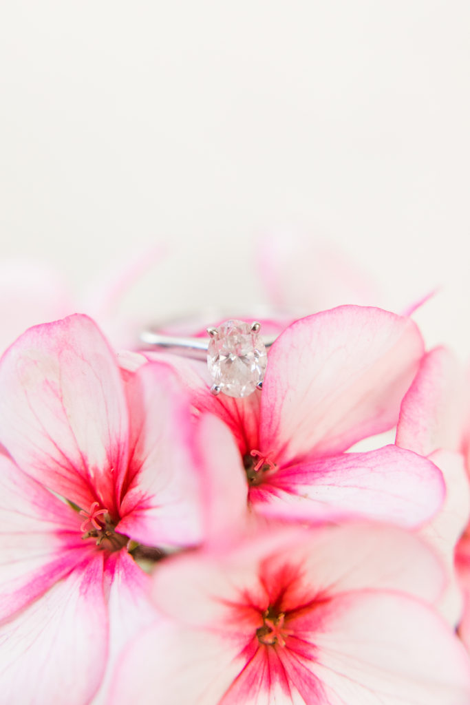 oval solitaire engagement ring in pink flowers - Sacramento engagement photos - Angela Sue Photography