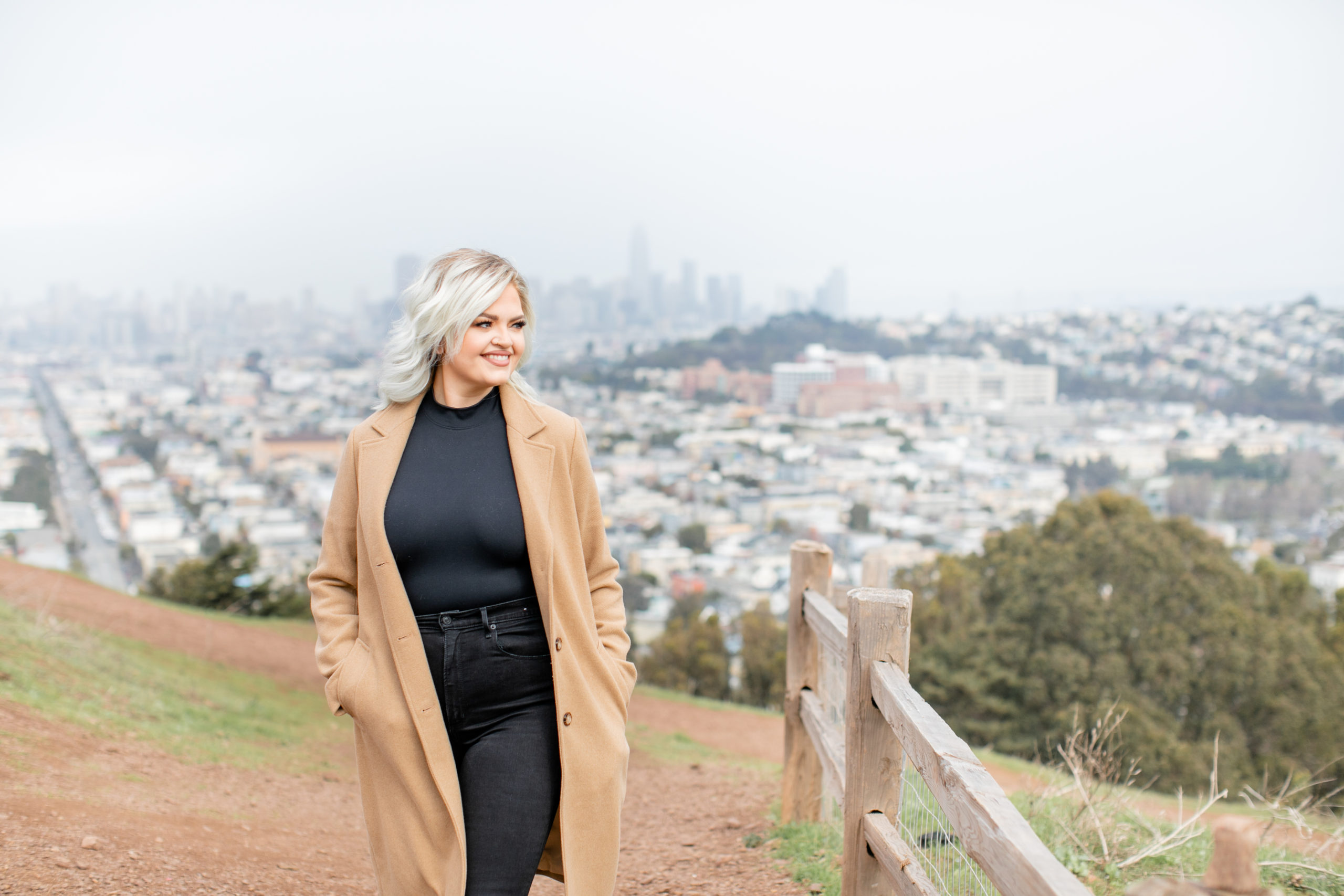 Career woman with San Francisco skyline in background