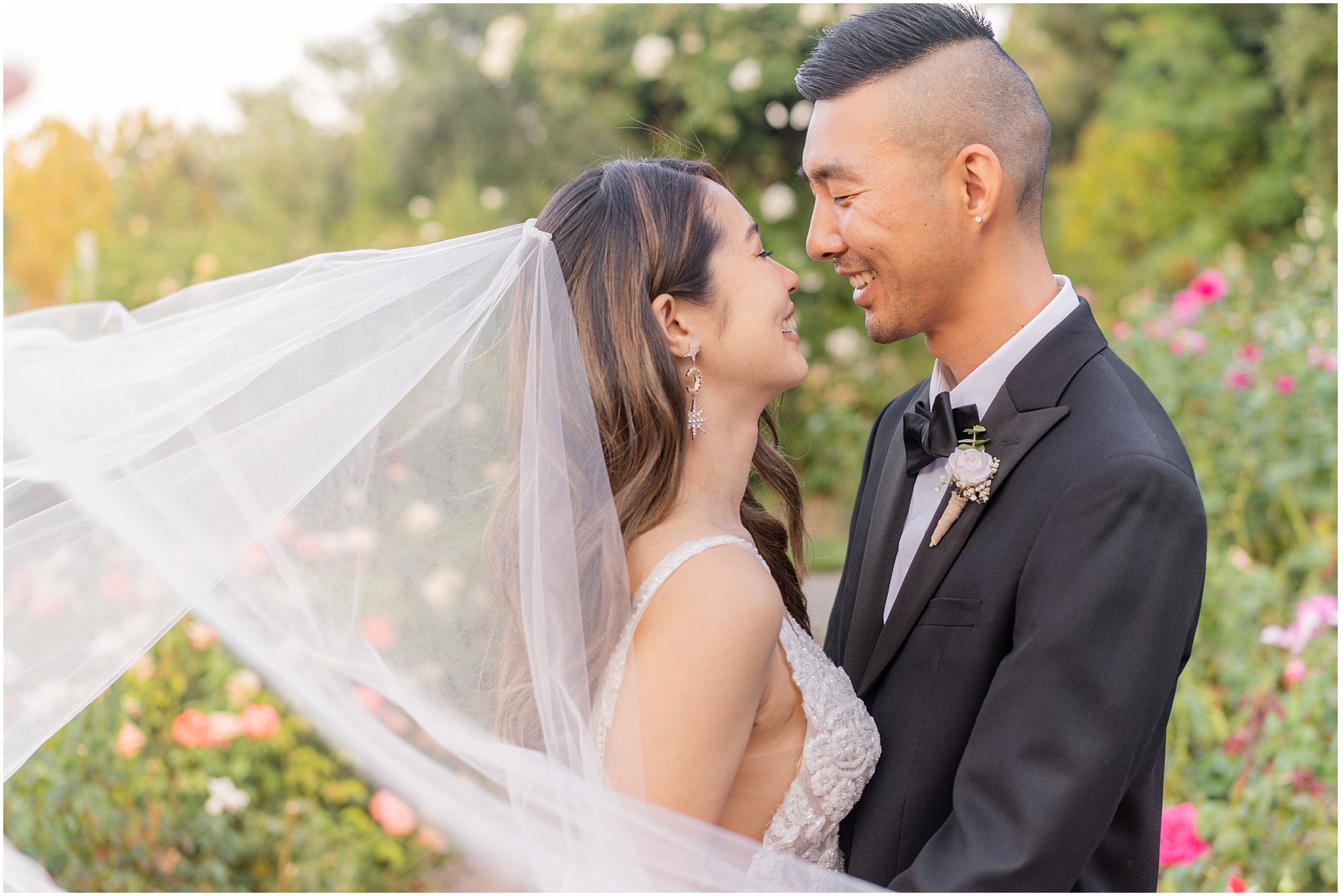 newlyweds with sweeping veil
